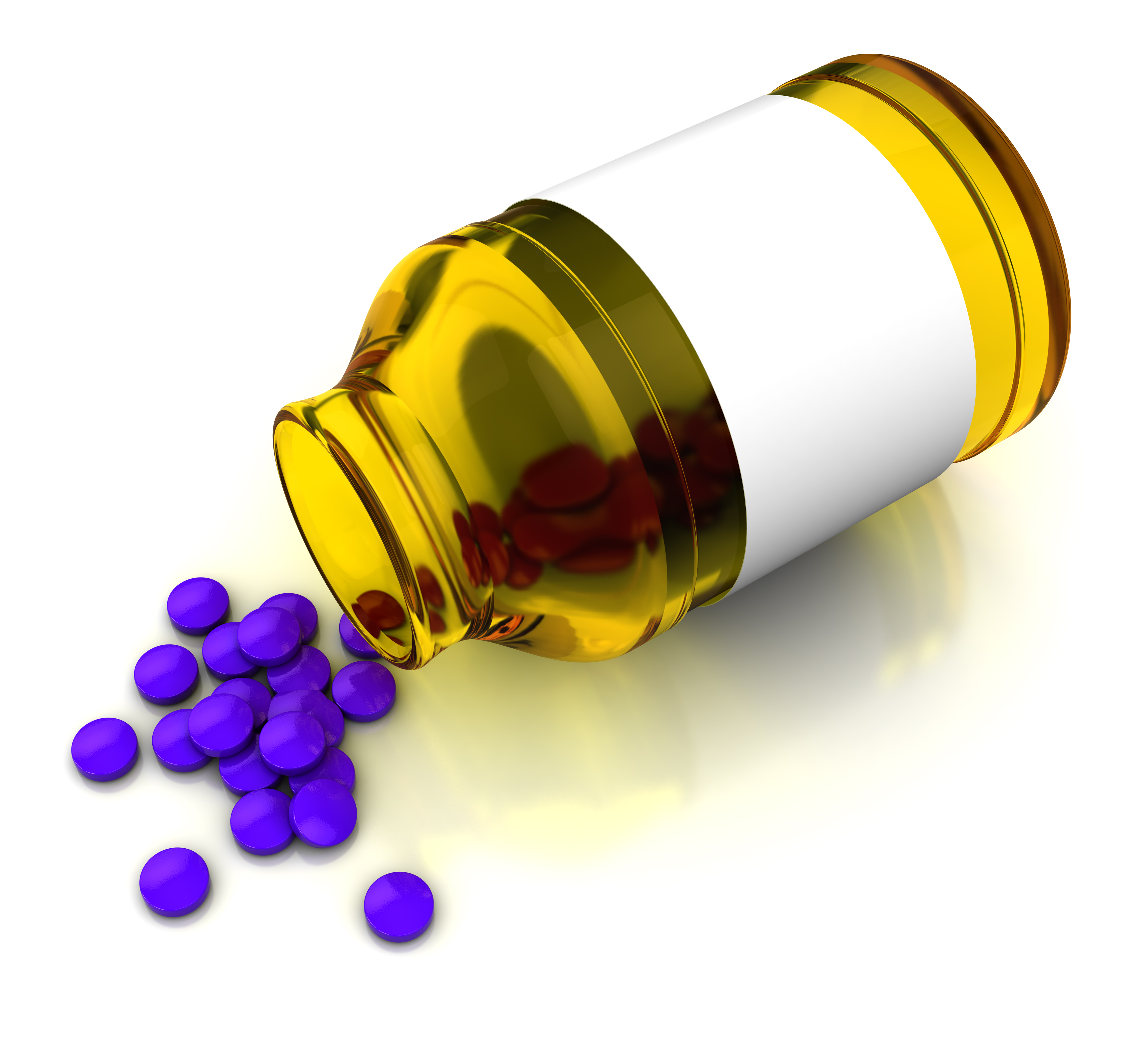 Piller kommer ut av et glass