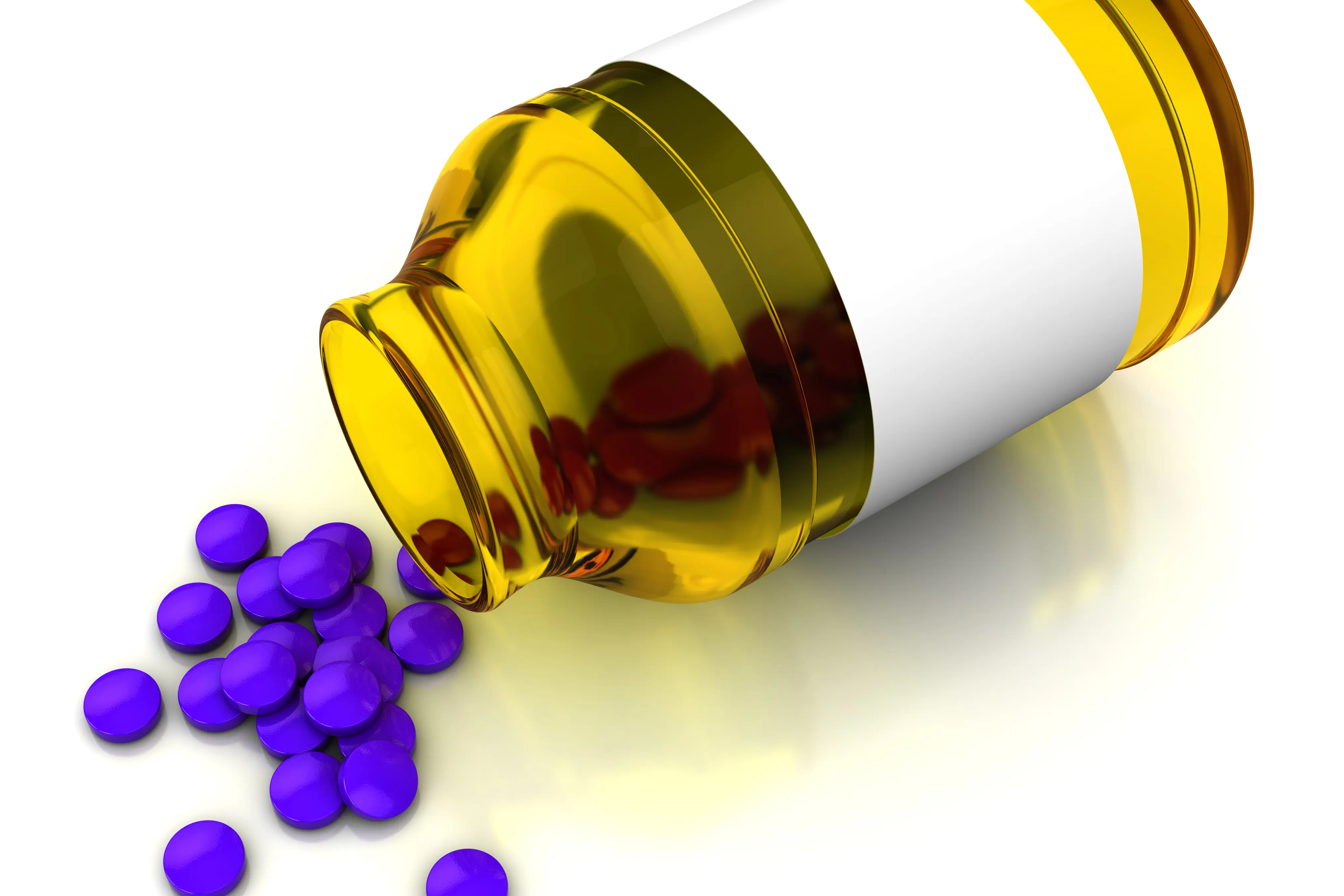 Piller kommer ut av et glass