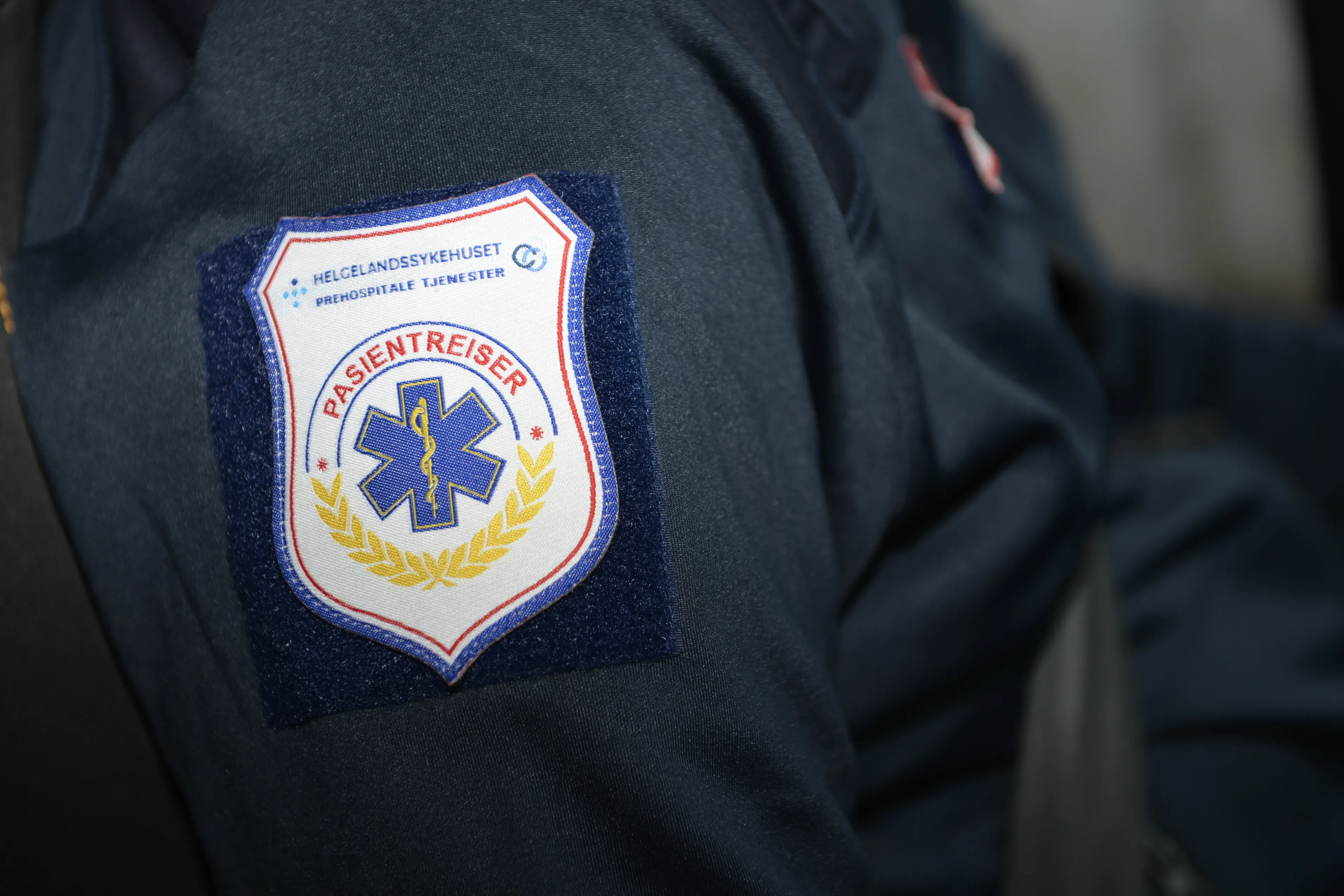 Nærbilde av en kleslapp med påskriften "Pasientreiser"