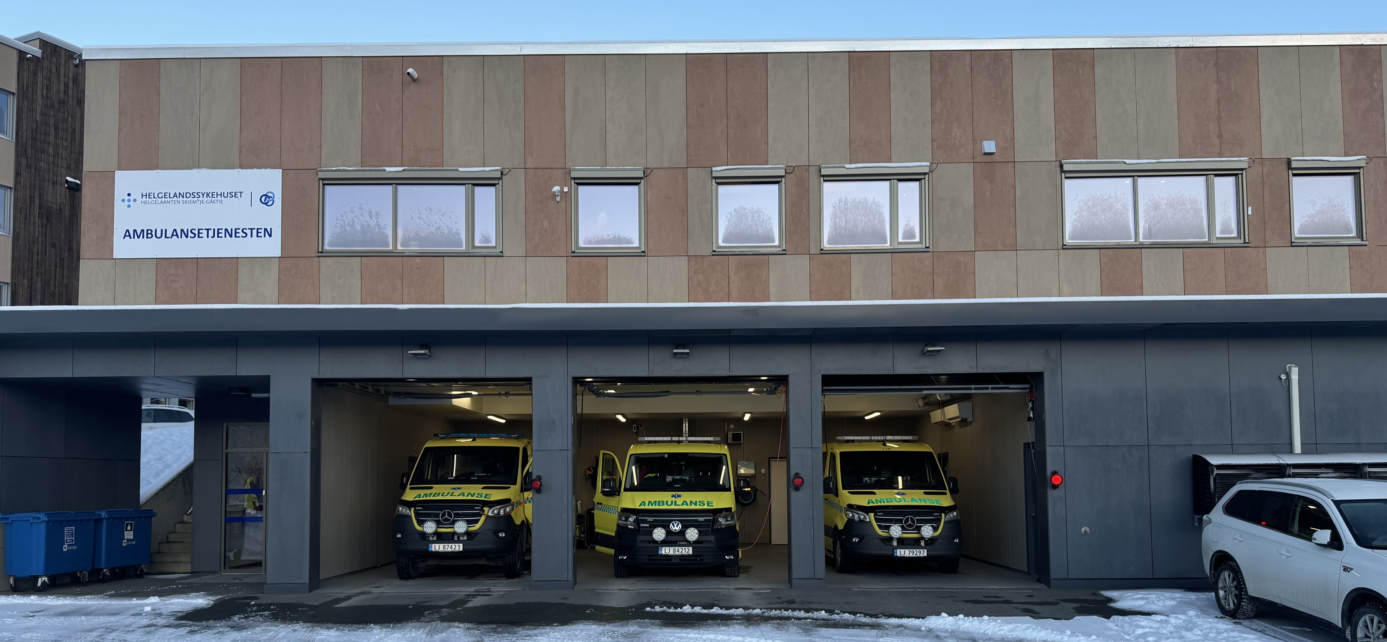 A group of vehicles parked outside a building