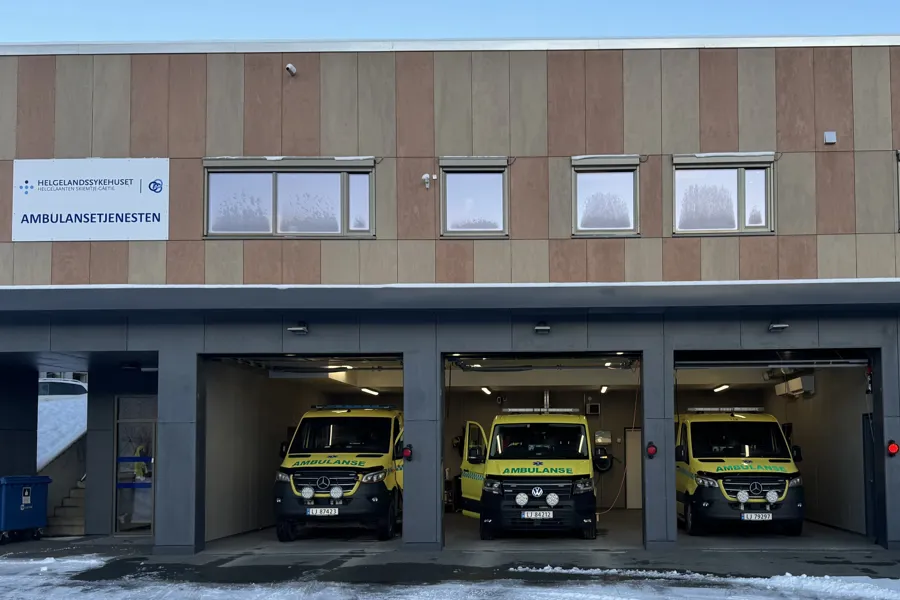 A group of vehicles parked outside a building